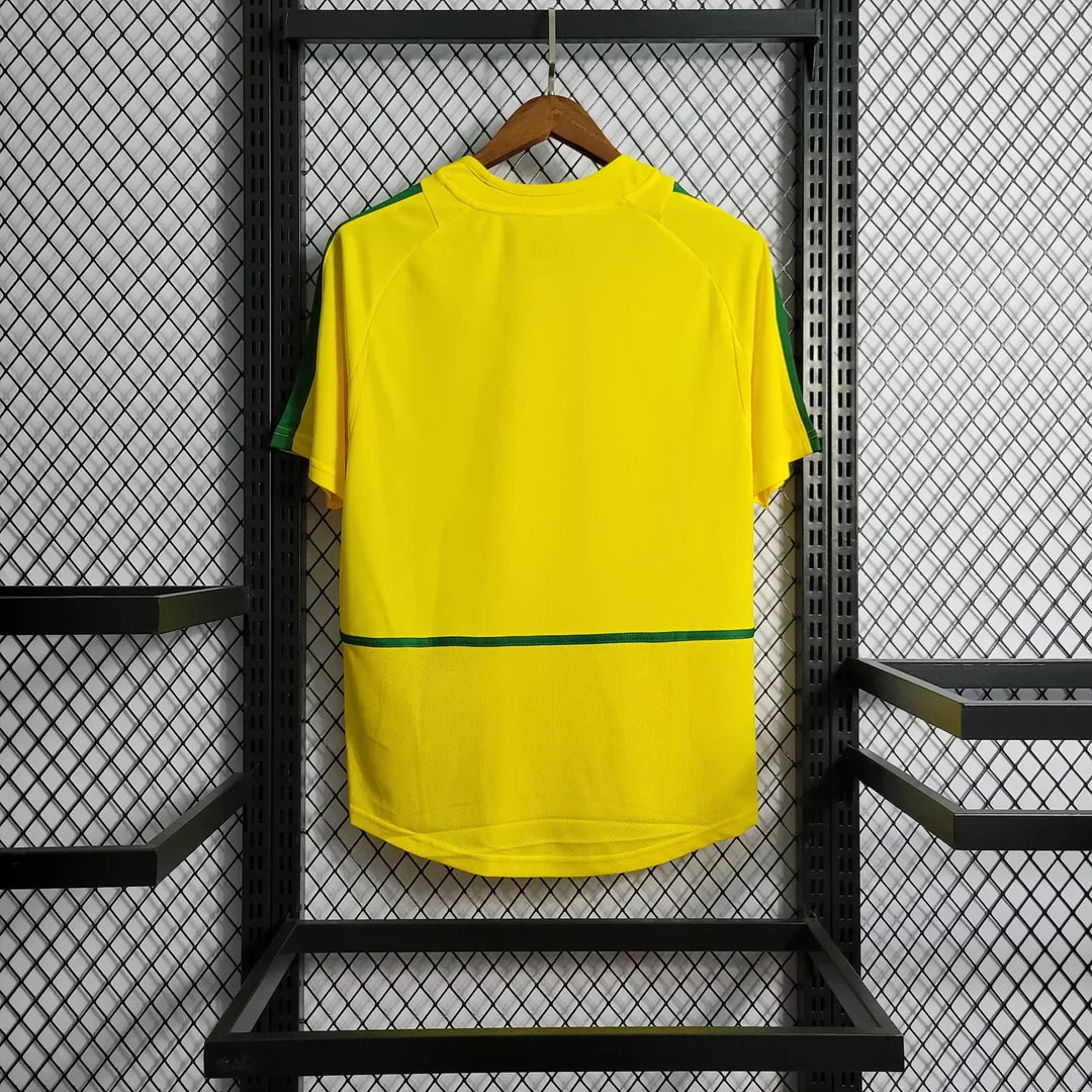 https://cdn.shopify.com/s/files/1/0911/7686/1985/files/BRAZIL2002HOMESHIRT2.webp?v=1731956135