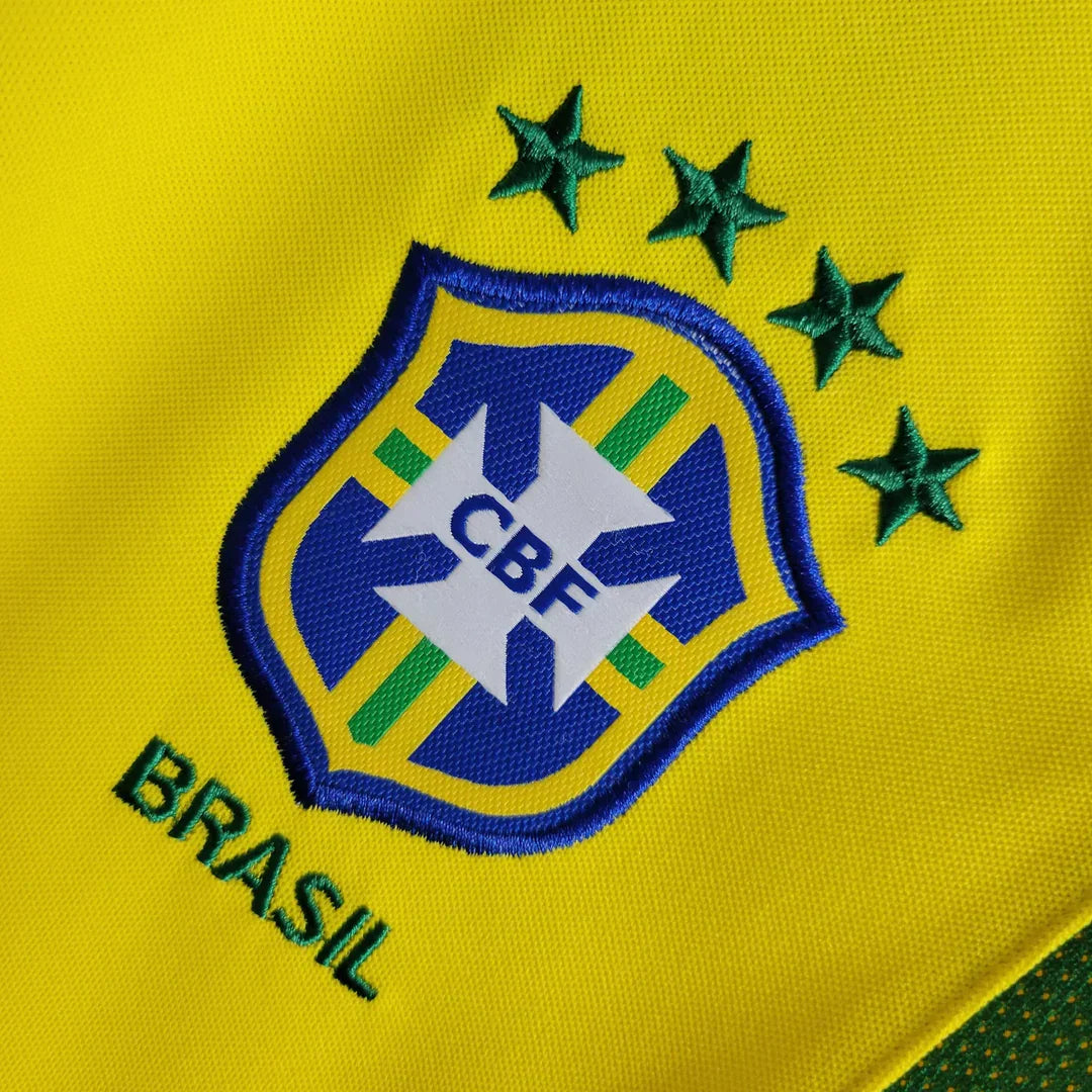 https://cdn.shopify.com/s/files/1/0911/7686/1985/files/BRAZIL2002HOMESHIRT3.webp?v=1731956135
