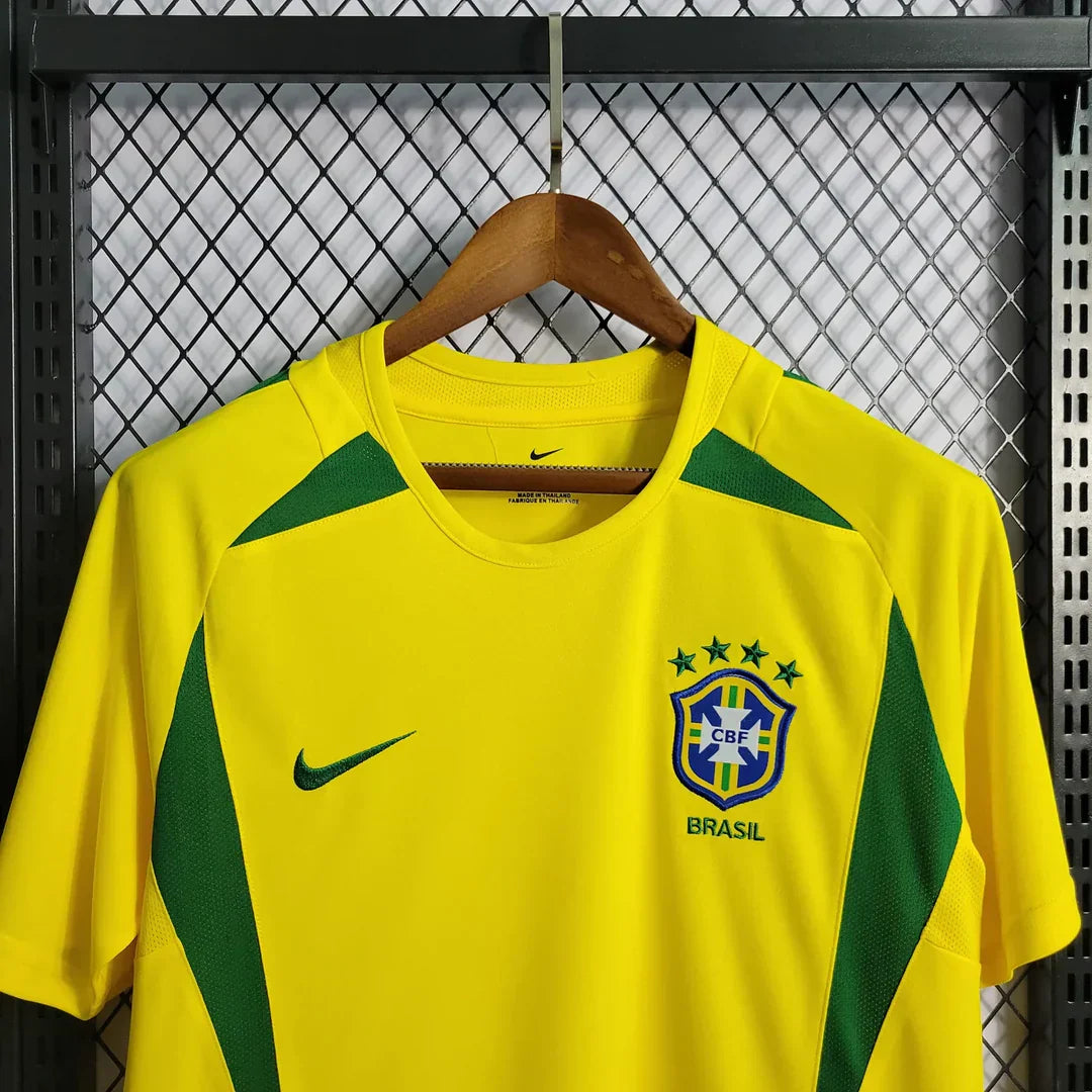 https://cdn.shopify.com/s/files/1/0911/7686/1985/files/BRAZIL2002HOMESHIRT4.webp?v=1731956134