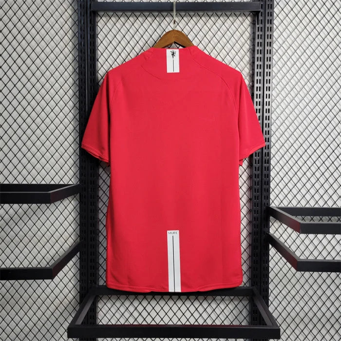 https://cdn.shopify.com/s/files/1/0911/7686/1985/files/MANCHESTERUNITED2007_08HOMESHIRT2.webp?v=1731956099